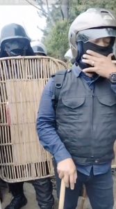 TPL Security armed with sticks and rattan shields - image from Instagram https://www.instagram.com/reel/DO56d4vkVCF/